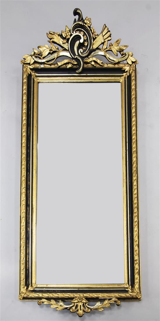 A late 19th century Swedish ebonised and parcel gilt rectangular shaped wall mirror, 5ft 1in. x 2ft 1in.